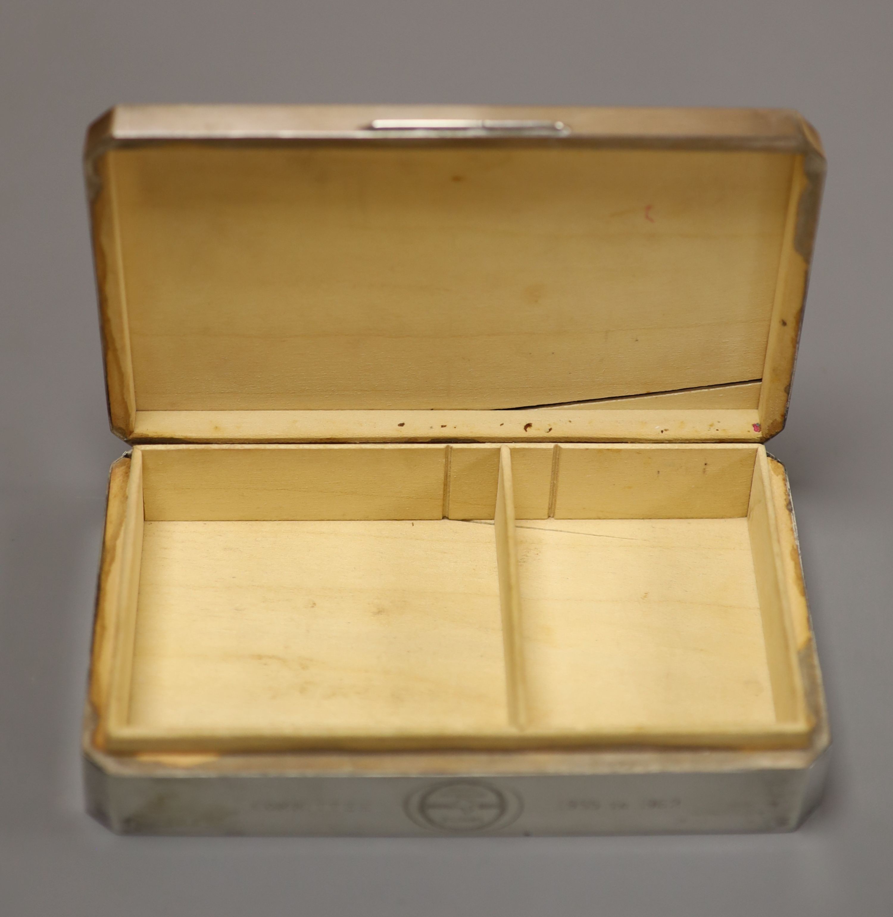 Three silver mounted cigarette cases, largest 17.9cm.